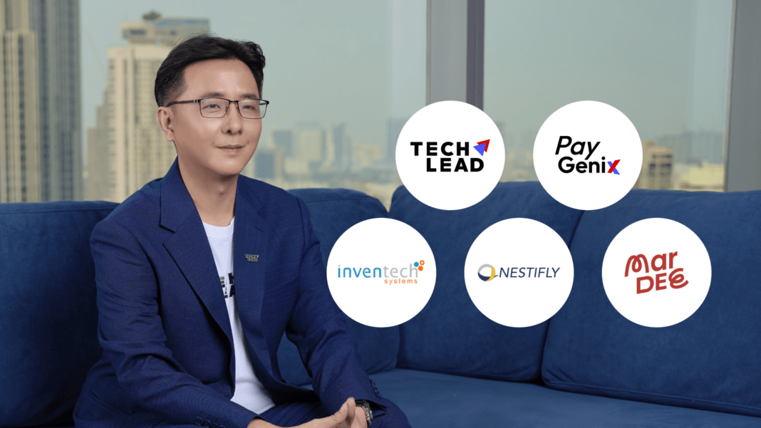 techlead-next-tl-q1-2026-revenue-growth-ecosystem นายอิศรา เรืองสุขอุดม ประธานเจ้าหน้าที่บริหาร บริษัท เทคลีด เน็กซ์ จำกัด (มหาชน) หรือ TL พร้อมด้วยโลโก้บริษัทในเครือ