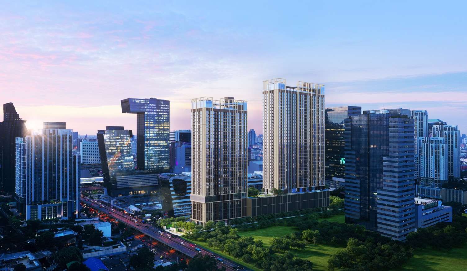 ภาพจำลองทัศนียภาพตึกคู่ของโครงการคอนโดมิเนียม Nue District R9 (นิว ดิสทริค อาร์ 9) ตั้งตระหง่านอยู่ใจกลางย่านธุรกิจย่านพระราม 9 ท่ามกลางตึกระฟ้าและแสงไฟในช่วงเวลาค่ำคืน