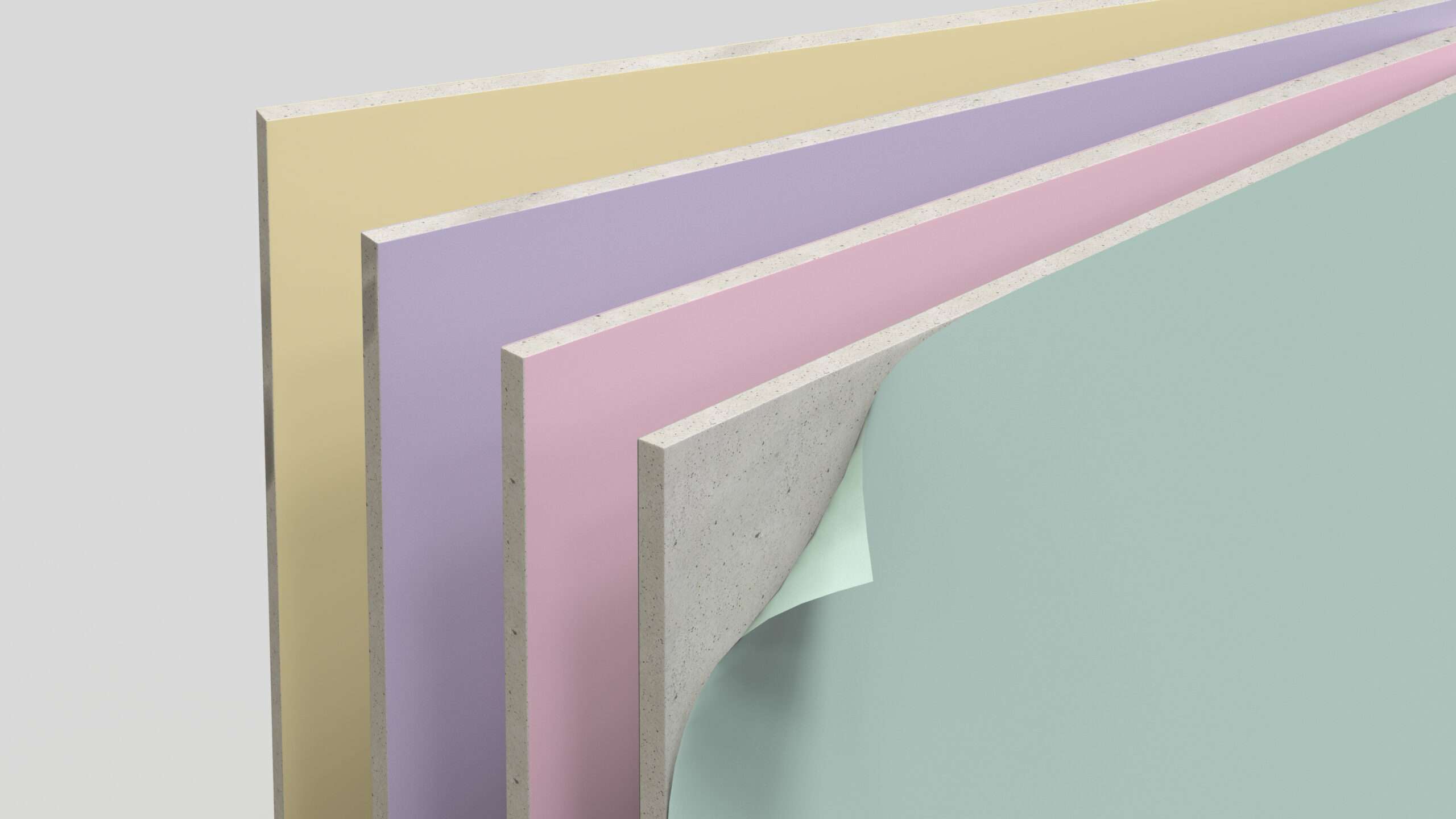 ภาพแผ่นยิปซัมหรือกระดาษสำหรับผลิตแผ่นยิปซัม (Plasterboard Liner) หลากหลายสีสัน วางซ้อนกันอย่างเป็นระเบียบ แสดงถึงผลิตภัณฑ์มูลค่าสูงที่ SCGP เตรียมขยายกำลังการผลิต
